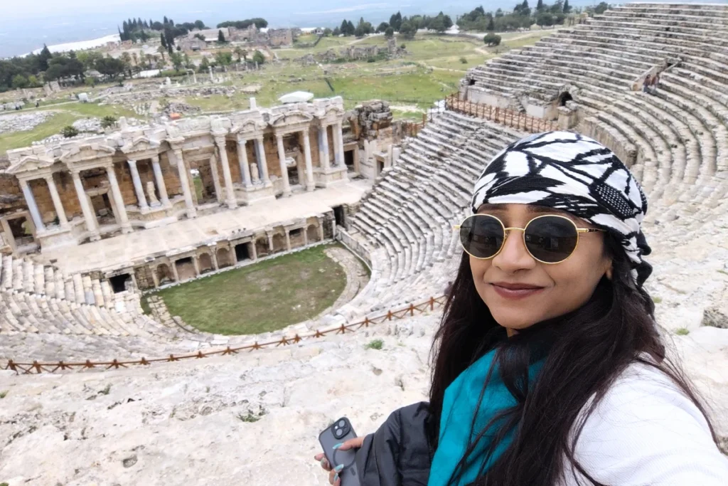  Sumana posing with the ancient stone ruins of Hierapolis in the background.
