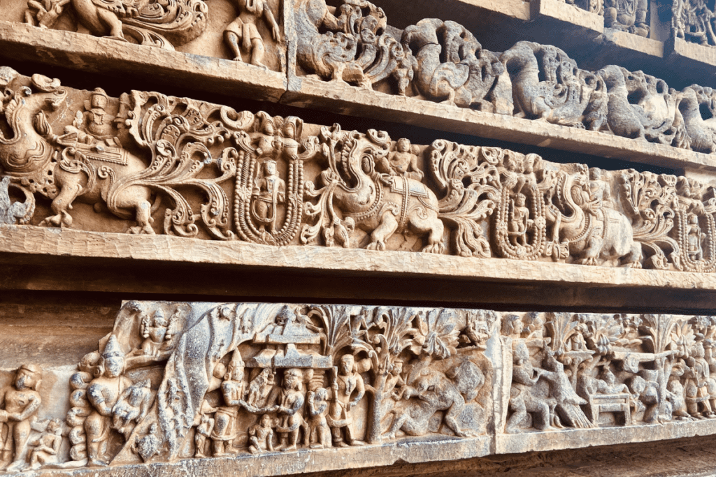 Intricate Hoysala sculptural carvings on outer wall of Hoysaleswara Temple Halebidu Karnataka