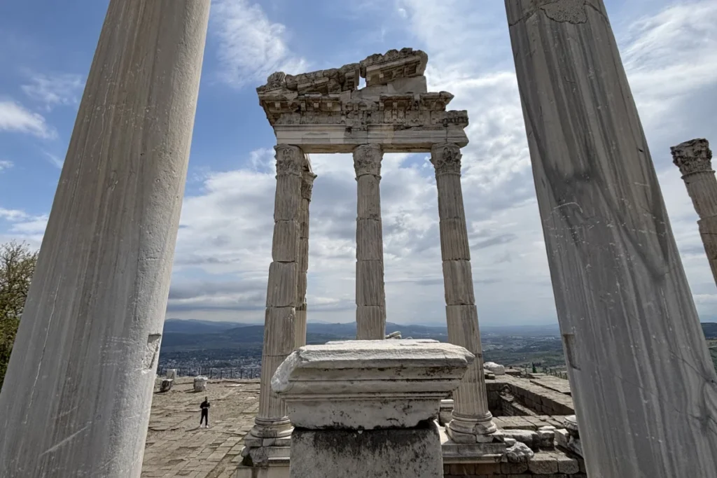 The remains of the ancient stone columns of the Trajan Temple standing prominently on the hillside acropolis of Pergamon.