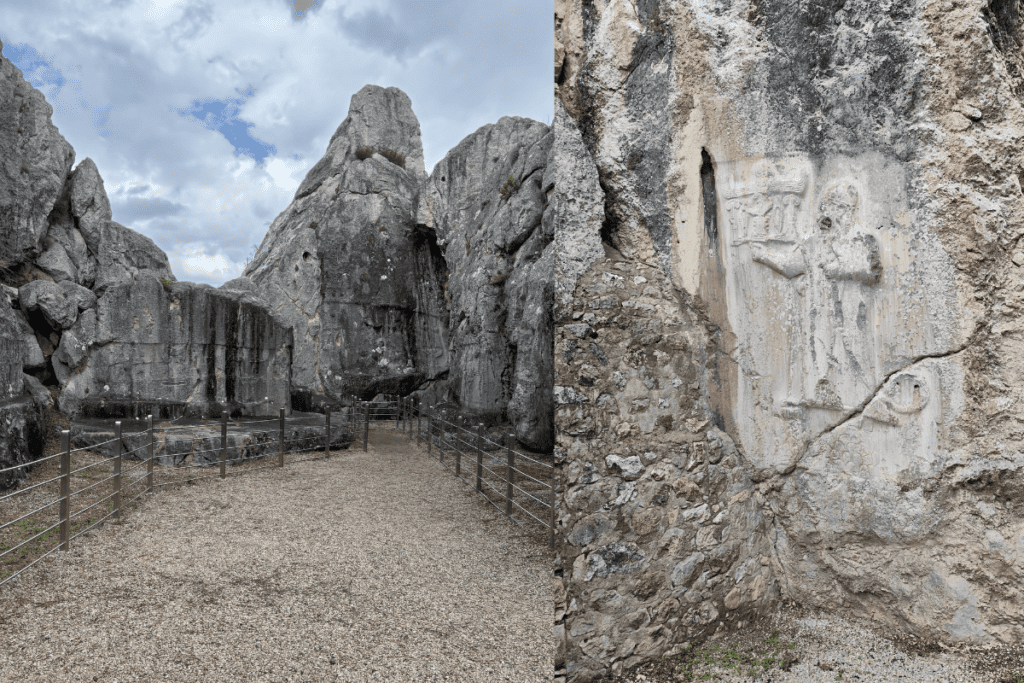 A narrow path cutting between towering, vertical limestone rock formations leading into an open sanctuary chamber.