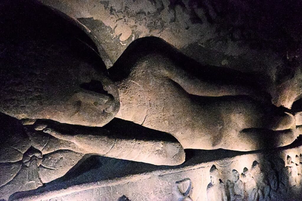 Ajanta Cave 5 A full-length view of the 24-foot-long reclining Buddha rock sculpture along the interior wall of Cave 26 at Ajanta.