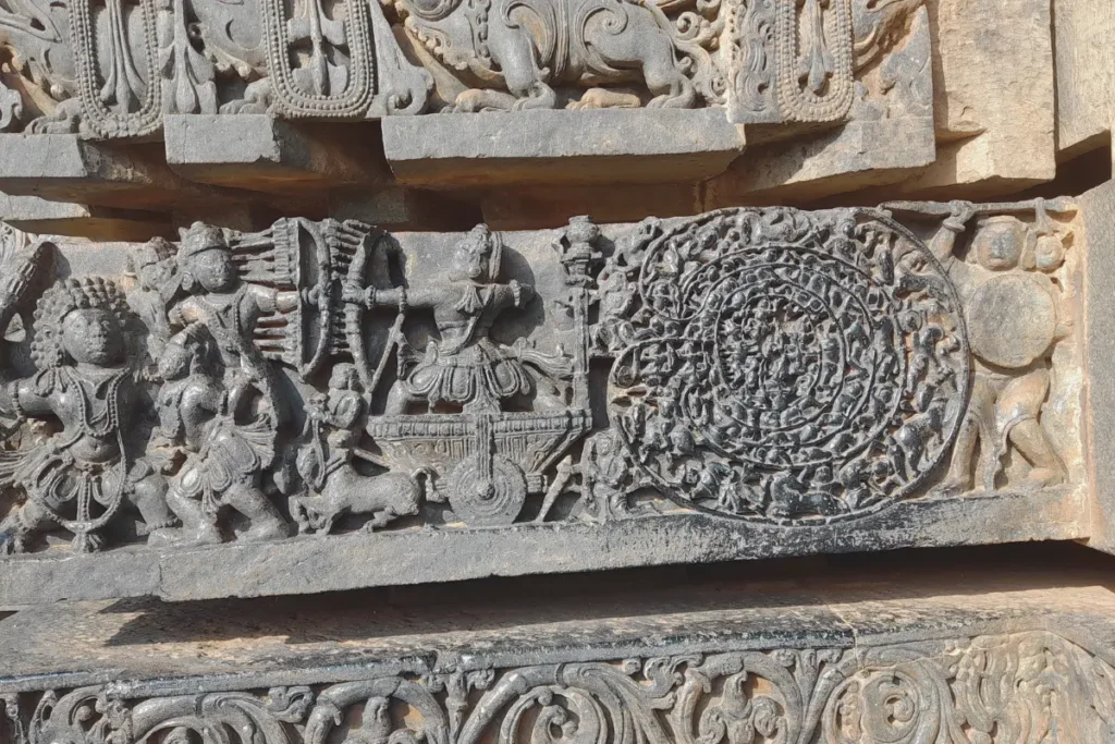 Hoysalaswar Temple 3 A horizontal band of carved stone reliefs depicting action scenes and battle narrative figures from the Mahabharata.