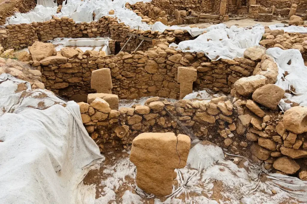 Karahan Tepe 6 A close-up view of ancient dry-stone walls and carved T-shaped limestone pillars uncovered at the site.
