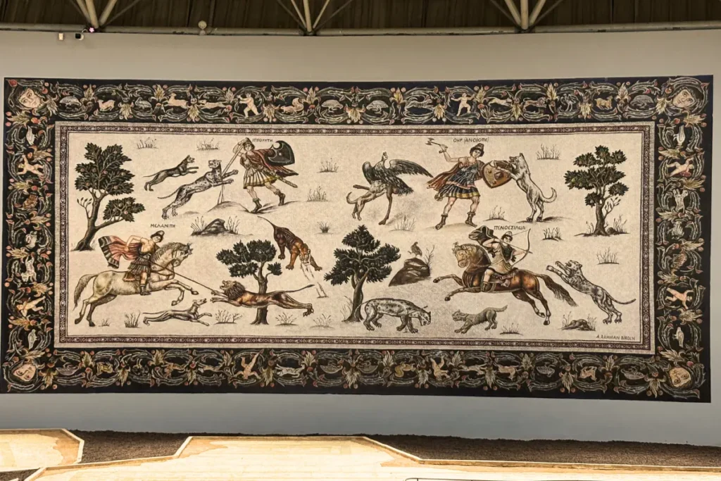 A large, intact Roman mosaic floor panel depicting the mythical figure Orpheus playing his lyre surrounded by wild animals.