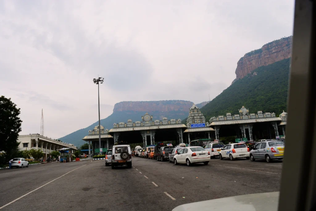 Tirupati- Bus Stand A wide view of a modern toll plaza or transit checkpoint area on a highway leading toward Tirupati.