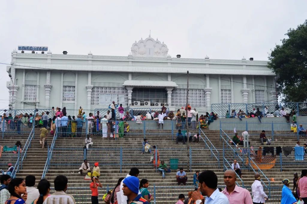 Tirupati- temple complex A wide view of a large white institutional or administrative building with an arched entrance gate.