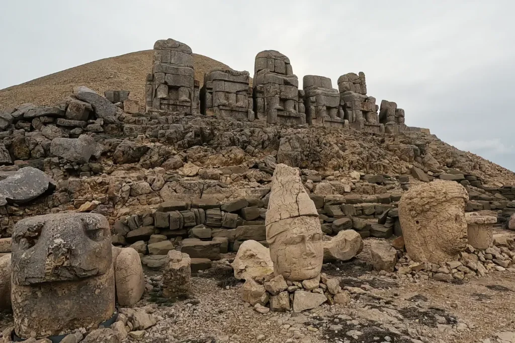 MT. NEMRUT -1 A distant shot showing the artificial gravel tumulus mound at the summit of Mount Nemrut along with the East Terrace stone statues.