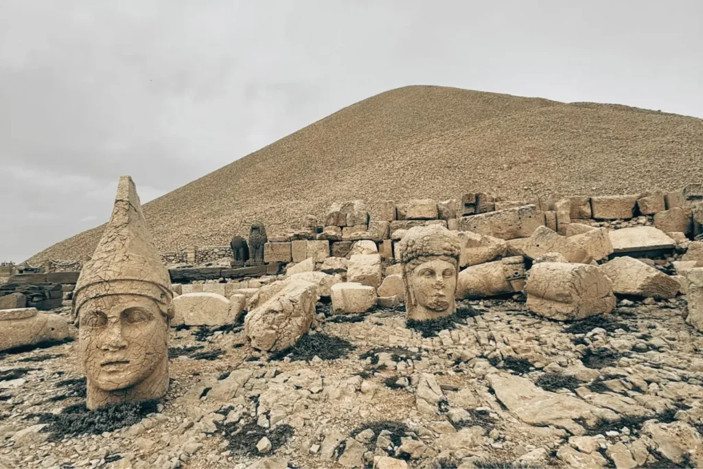 MT. NEMRUT -3 A close-up view of the carved stone head of King Antiochus and surrounding ancient statues on the West Terrace at Mount Nemrut.
