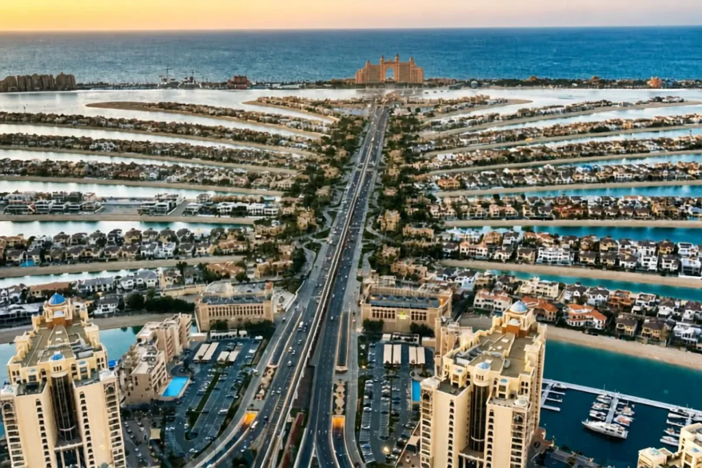 Dubai- Palm 5 High-angle aerial view of the iconic Palm JUMEIRAH tree-shaped artificial archipelago extending out into the blue ocean waters.