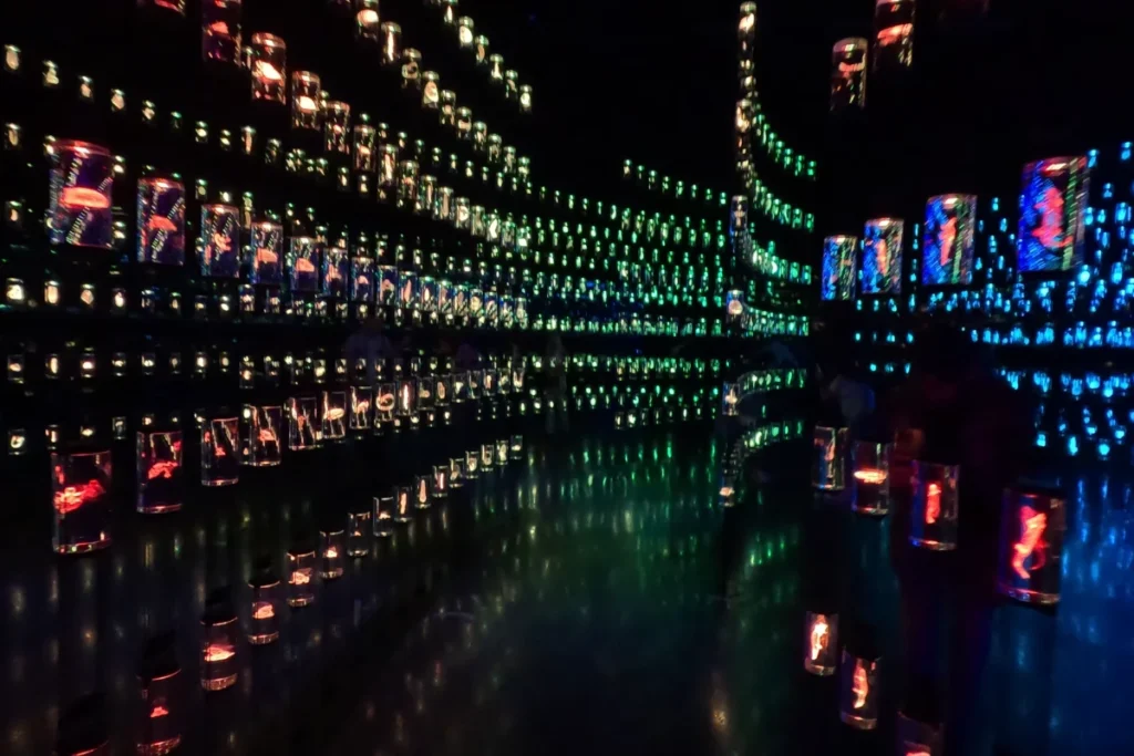 Museum of the future 2 Glowing illuminated glass cylinders arranged in rows containing biological samples inside the futuristic DNA library exhibit.