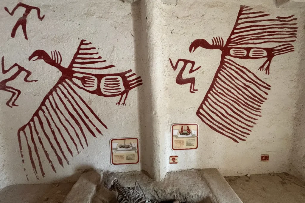 CatalHoyuk 7 Prehistoric wall painting reproduction depicting vultures and headless human figures.